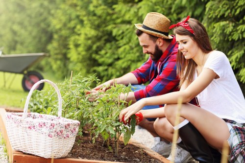 Professional gardener tending to a lush green lawn in Cleaners N10